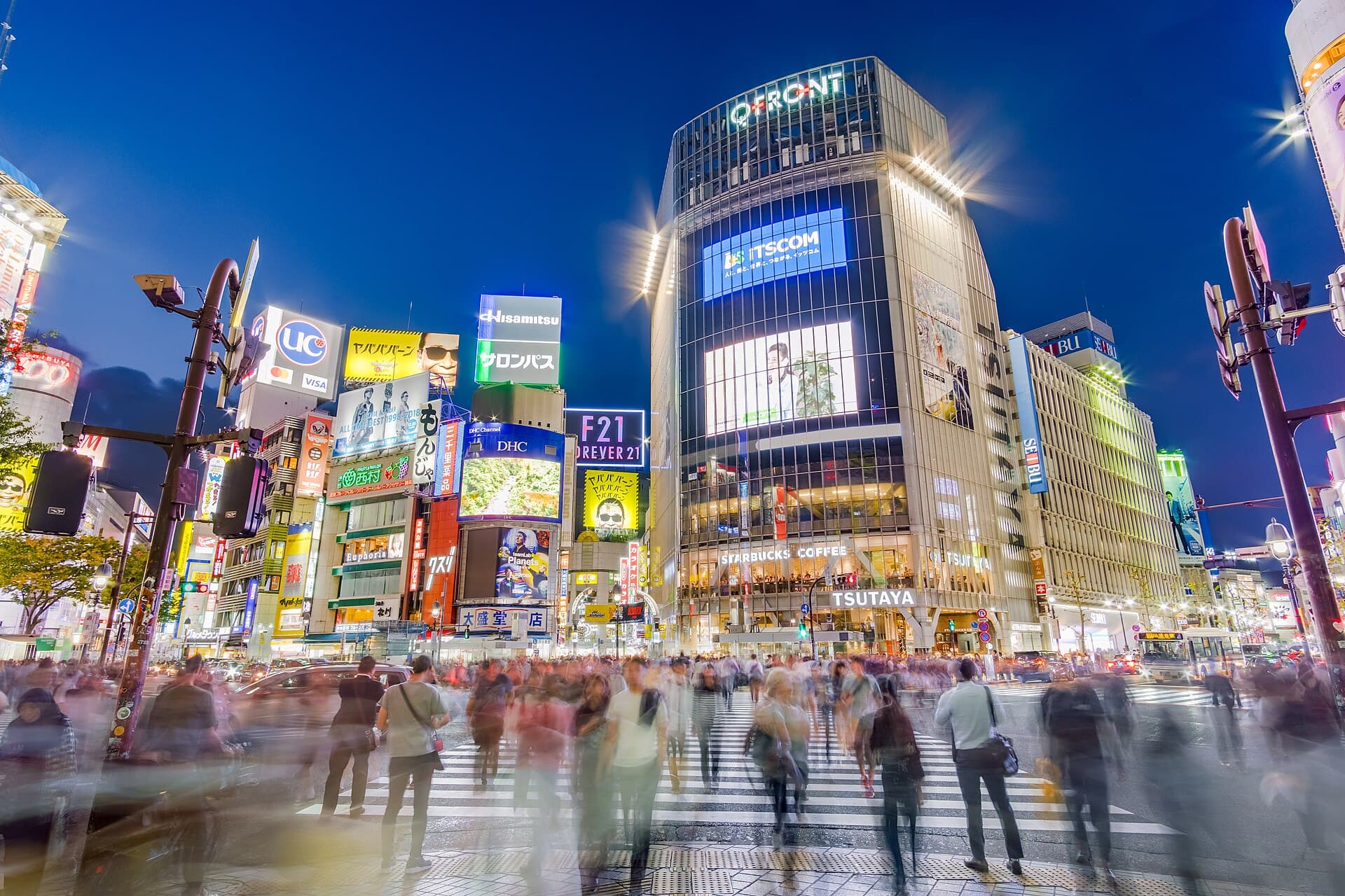 Tokyo travel planning photo showing Pedestrians crossing perhaps the most famous scramble intersection in the world, in Shibuya, Tokyo, Japan. Taken from Hachikō square