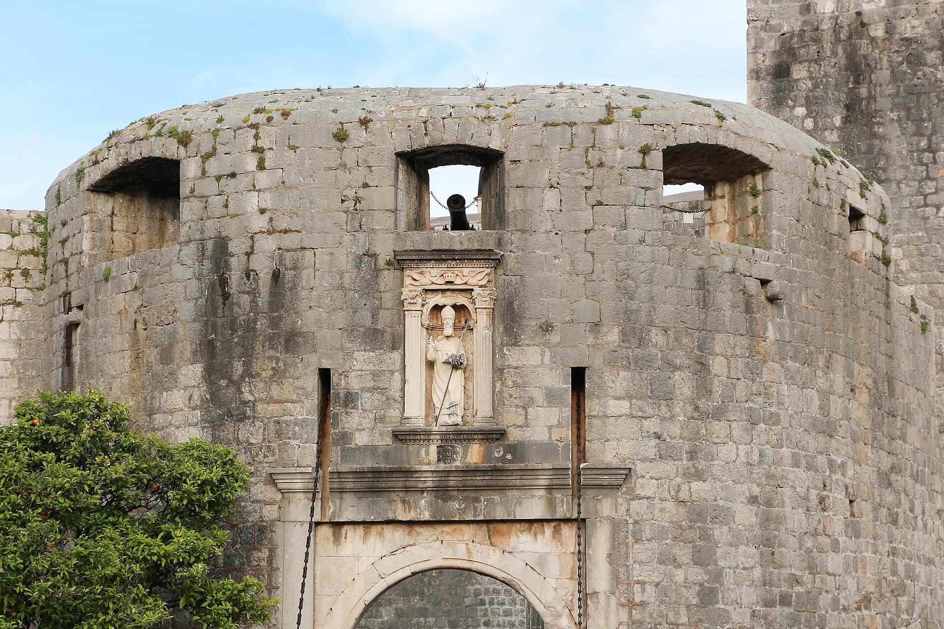 Pile Gate entrance to Dubrovnik Old Town with stone bridge and defensive walls